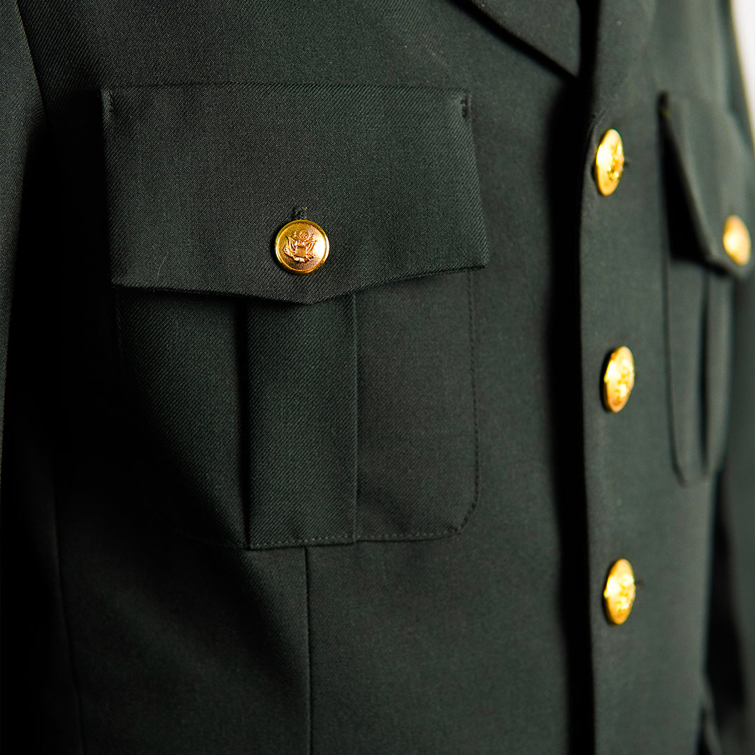 Close-up of a dark green military-style jacket with gold buttons.